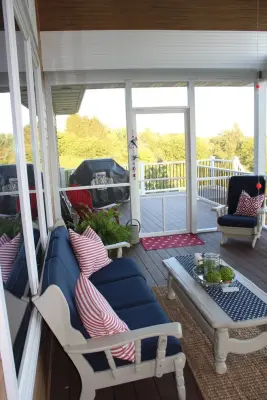 Tri-Season Porch Extension — Custom Cabinets & Cabinetry project by Spahn & Rose Lumber Co.