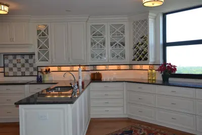 Light Cabinets and Stone Surfaces — Custom Cabinets & Cabinetry project by Cornerstone Builders Of SWFL