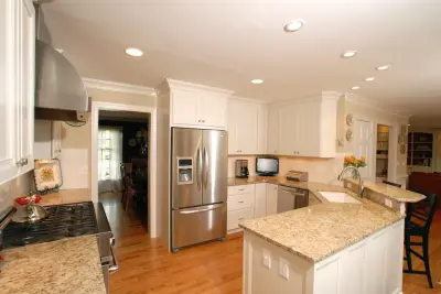 Williamsburg White Flat-Panel Kitchen Design — Custom Cabinets & Cabinetry project by Buckeye Cabinet & Supply, Inc.