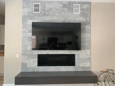 Natural stone backsplash for fireplace hearth — Countertop Installation Services project by CMG Granite And Stone Inc.