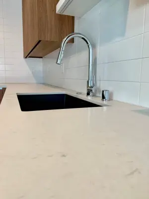 Quartz Surfaces with Tile Accent — Countertop Installation Services project by CMG Granite And Stone Inc.