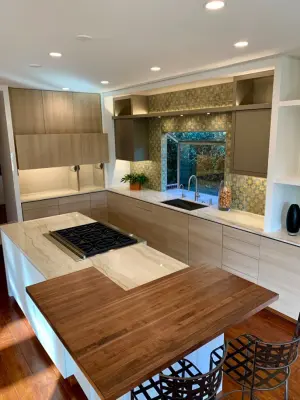 Quartzite Stone Kitchen Countertops with Tiled Backsplash — Countertop Installation Services project by CMG Granite And Stone Inc.