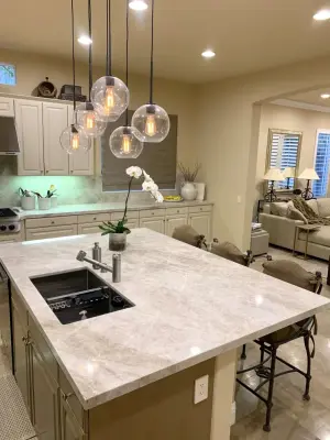Quartzite Tajm Kitchen Countertops with Full Backsplash and Island — Countertop Installation Services project by CMG Granite And Stone Inc.