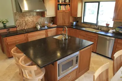 Textured Stone and Tropical Splashback — Countertop Installation Services project by Pacific Stoneworks Inc