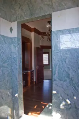 Costa Esmeralda Shower Surface by American Marble & Granite