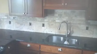 Green Butterfly Granite Kitchen — Countertop Installation Services project by Granite Concepts