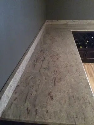 Espresso Cabinets with White River Granite — Countertop Installation Services project by Factory Plaza Inc