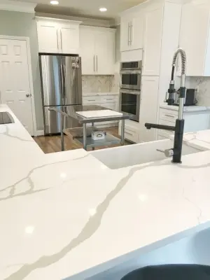 Advanced Shaker Cabinets with Calacatta Gold Quartz in North Carolina by Prostone Granite & Cabinetry