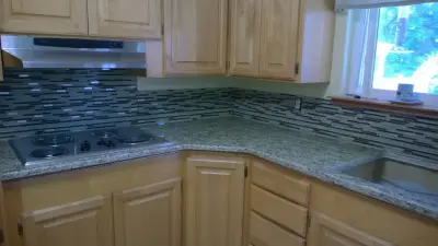 Ornamental Backsplashes — Countertop Installation Services project by Tops Solid Surface