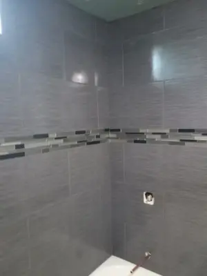 Ongoing Bathroom Renovations — Countertop Installation Services project by Bonetti Tile