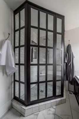 Bathroom Renovation Featuring Superwhite Quartzite and Gridscape Shower — Countertop Installation Services project by Counter Culture