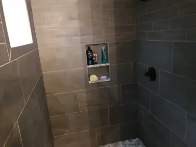 Shower Barrier and Niche Shelving — Countertop Installation Services project by Olympia Stone Ltd.