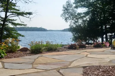Flagstone patio, retaining wall and rain garden by Landsburg Landscape Nursery