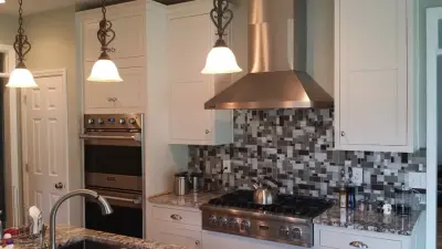 Elegant White Shaker Kitchen Featuring Unique Granite — Countertop Installation Services project by Stoneworld Tn