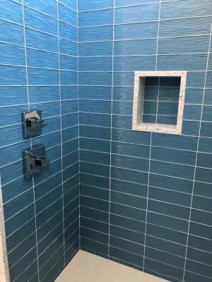 Custom Blue Wave Glass Tile Shower Installation at Hilton Head — Countertop Installation Services project by Prestige Stone & Tile