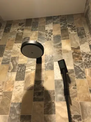Bespoke Rustic Beige Shower Tile Setup — Countertop Installation Services project by Prestige Stone & Tile