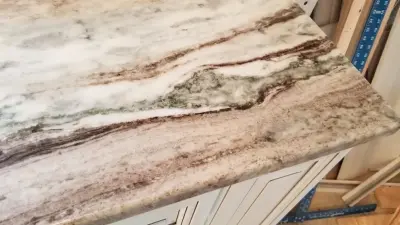Brown Fantasy Granite Surfaces — Countertop Installation Services project by Tops Solid Surface