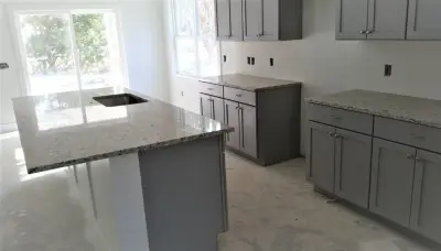 Granite Countertops and Kitchen Island — Countertop Installation Services project by Stone Interiors LLC