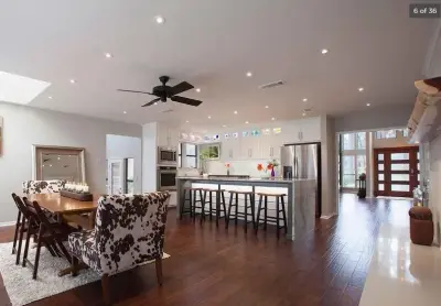 Waterfall Edge Kitchen Island — Countertop Installation Services project by Granite Division Inc.