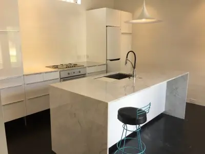 Carrera Marble Waterfall Sides for Kitchen Island — Countertop Installation Services project by LaBruyere Stone