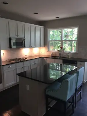 Stone tile wall panel — Countertop Installation Services project by Brinson Custom Tile