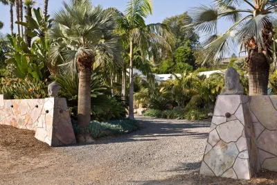 Backyard Landscape Design with Pool, Fireplace, and Custom Stonework — Landscape Design project by C & H Gardens Artistic Landscape & Tree Service