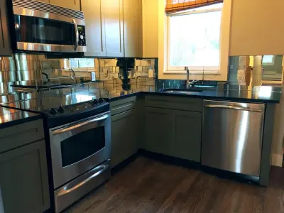 Vintage Mirror Tile Backsplash in Contemporary Kitchen Design — Countertop Installation Services project by Penner Remodels