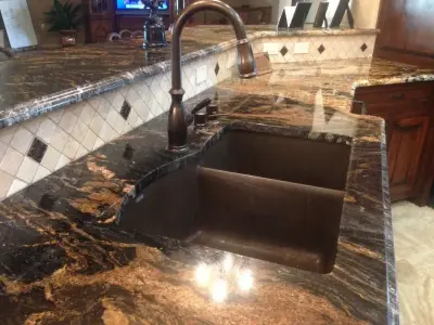 Classic Kitchen Featuring Dark Granite — Countertop Installation Services project by Sandia Marble