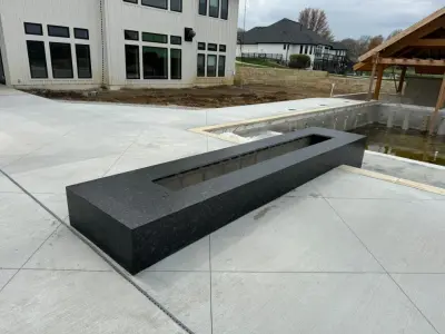 Natural Stone Outdoor Fireplace — Countertop Installation Services project by Euroselect Stone LLC