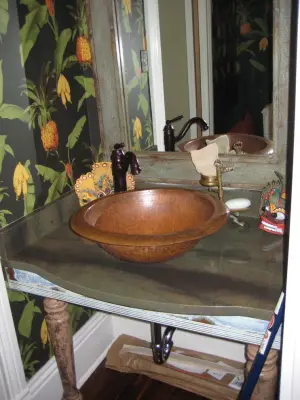 Vanity in Powder Room with Wild Sea Granite — Countertop Installation Services project by LaBruyere Stone