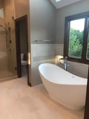 Woodbury - Remodeling of Two Guest Bathrooms and Master Bathroom — Countertop Installation Services project by Natural Stone & Tile