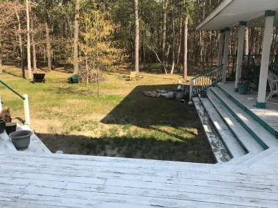13'x20' Pond with Three-Tier Waterfall and Natural Stone Patio — Landscape Construction project by Landvista Aquascapes