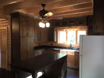 Rustic Knotty Alder Umber Raised Panel with Quartz Surface — Countertop Installation Services project by PSI Tops | Plastic Specialties Inc