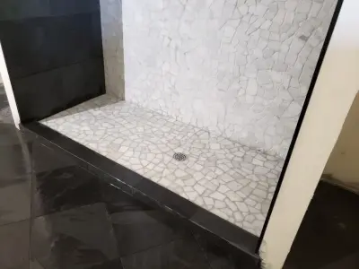 Bathroom floor and shower renovation — Countertop Installation Services project by Desert Mountain Interiors