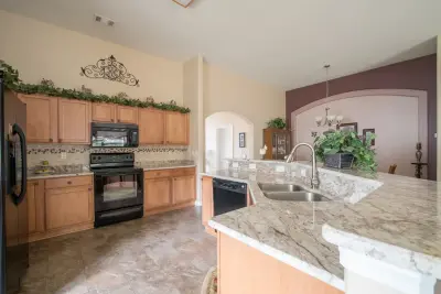 Bordeaux Granite Kitchen Countertops in Sienna — Countertop Installation Services project by East Coast Granite & Tile