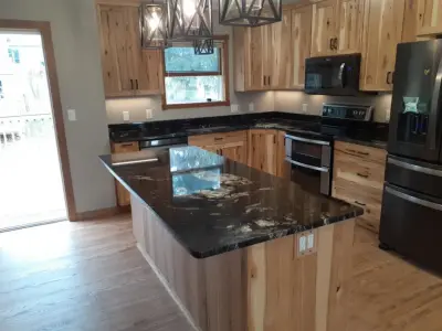 Titanium Culinary Renovation — Countertop Installation Services project by Rochester Granite Designs