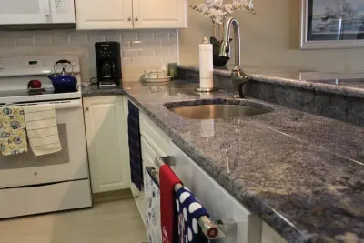 Classic Kitchen with Blue Bahia Countertops — Countertop Installation Services project by Merlino Marble And Granite