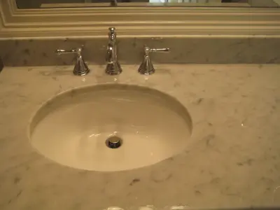Carrera Marble Vanity — Countertop Installation Services project by LaBruyere Stone