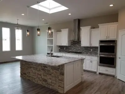 Whispering White Granite Kitchen — Countertop Installation Services project by Sandia Marble