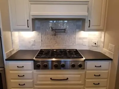 Monochrome Leather Finish Kitchen — Countertop Installation Services project by Tex-San Granite