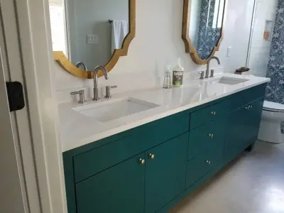 Green and White Bathroom — Countertop Installation Services project by Tex-San Granite
