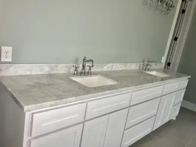 Carrara White Marble Countertops — Countertop Installation Services project by Stones & Designers