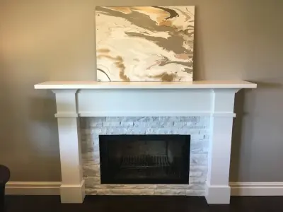 Quartz-Enhanced White Shaker Kitchen with Coordinating Fireplace — Countertop Installation Services project by PSI Tops | Plastic Specialties Inc