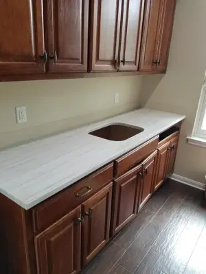 Quartzite Kitchen and Laundry in White Macabus — Countertop Installation Services project by Tex-San Granite
