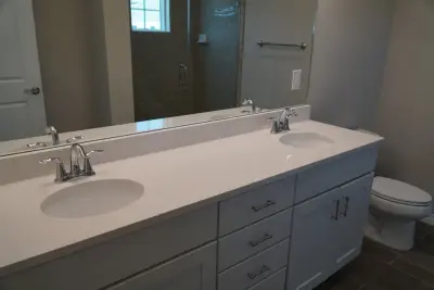 Quartzite Bathroom Countertops in White — Countertop Installation Services project by Paradise Granite LLC