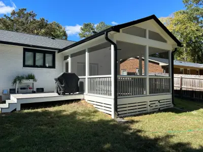 Porch extension with screening by Home Upgrades, LLC