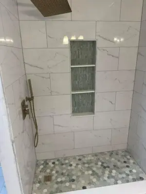 Bathroom Renovation | Walk-in Shower Featuring Mosaic Inlay Floors and Shelves — Home Renovation & Remodeling Services project by JMH Custom Builders