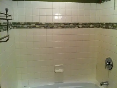 tiled border soaking bubble bath — Home Renovation & Remodeling Services project by Home Preservation Specialists Inc