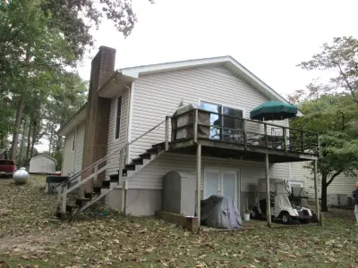 Composite Decking and Patio Covers for Sunroom — Home Renovation & Remodeling Services project by Kingsford Siding, Windows & Patio Rooms