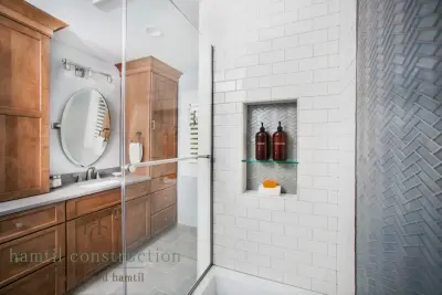 Three Bathrooms in Sunset Hills — Home Renovation & Remodeling Services project by Hamtil Construction, LLC